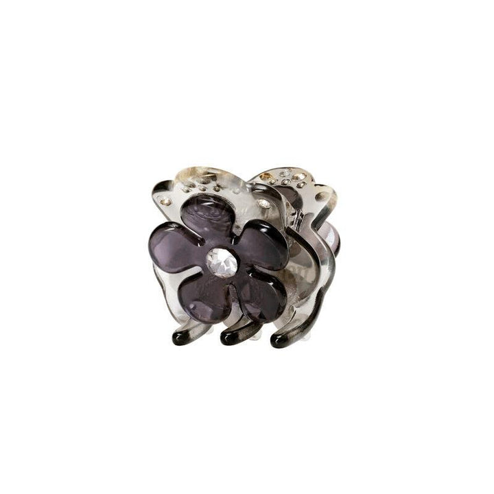 maanesten-kalina-fog-hairclaw viser en dekorativ hårklemme med lilla blomst og klar sten foran. Model3834