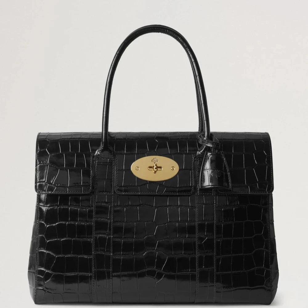 Mulberry Bayswater Croc Black viser en elegant sort håndtaske i krokodillepræget læder med gylden lås. Model HH9589641A100