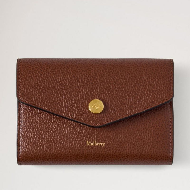 Mulberry Press Stud Wallet Oak Small Classic Grain, brun pung i præget læder med guldfarvet knapdetalje. Model RL9008552G110.