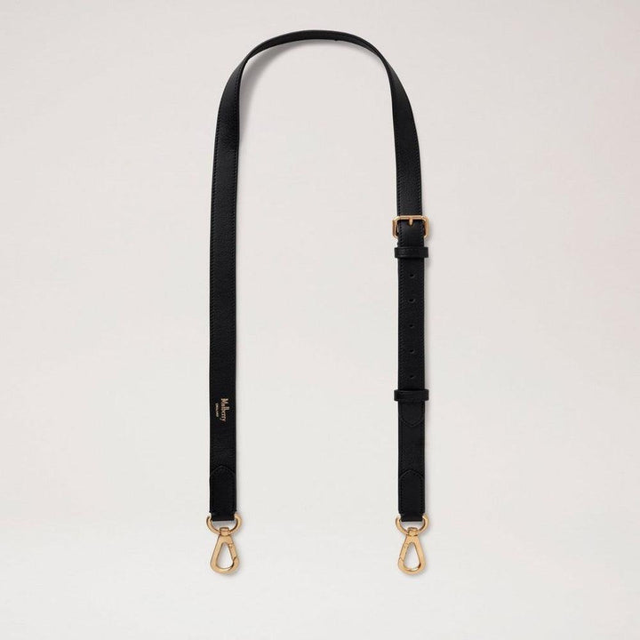 Mulberry Thin Leather Strap Black viser en sort, justerbar læderrem med guldfarvede metalspænder. Model RX0285587A100.