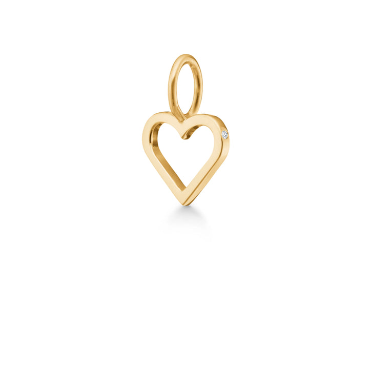 ro copenhagen symbols open heart vedhæng 18 kt guld viser et hjertevedhæng i blankt guld med lille diamantdetalje. Model p111y107-1