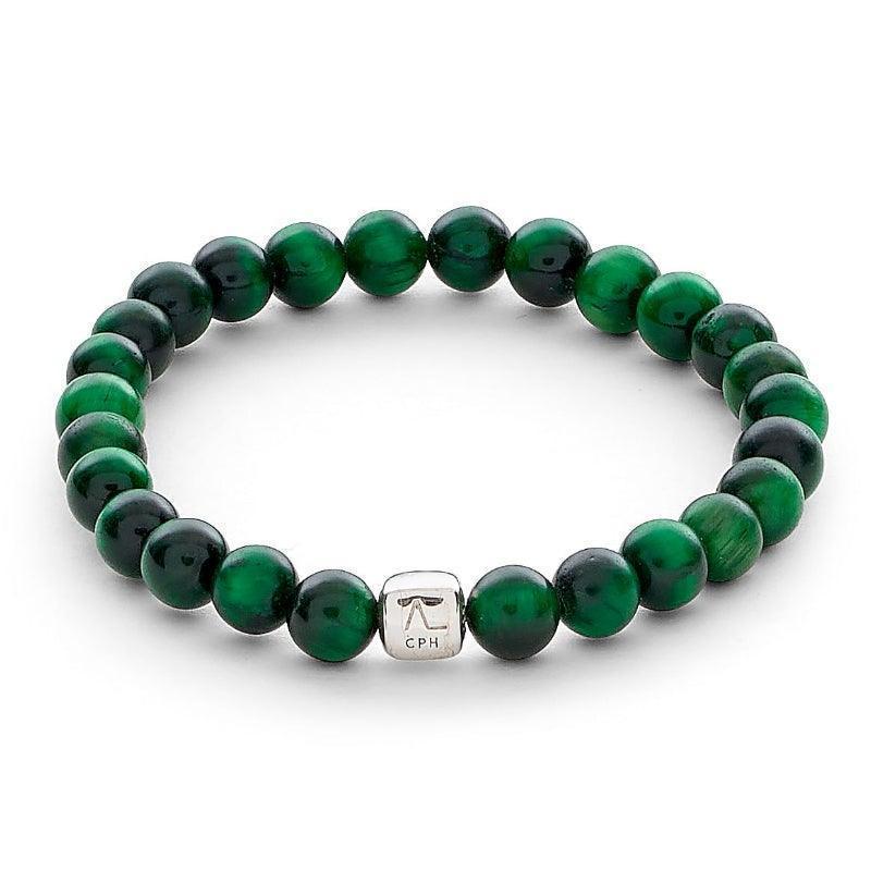 Alexander Lynggaard Armband Green Tiger Eye 6mm viser et elastisk armbånd med grønne tigerøje perler og en sølvfarvet detalje. Model c00353-001-1