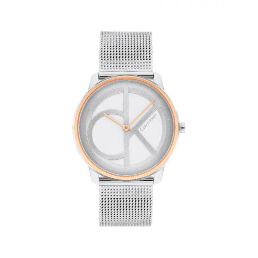 Calvin Klein Iconic Mesh Dameur, rund urskive med sølv mesh-rem og gylden kant. Model 25200033