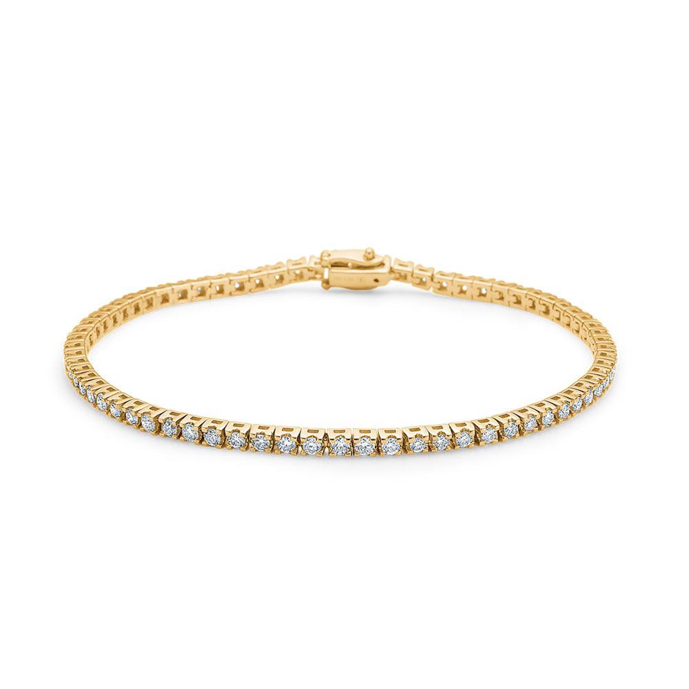 Mads Z 14kt Tennis Armbånd 1.53ct W/SI viser et elegant tennisarmbånd i guld med diamanter. Model 1551515-001.